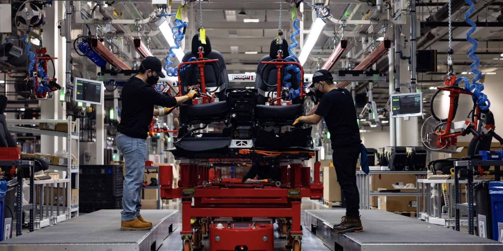 Tesla Gigafactory Texas attaching seats to a structural battery pack