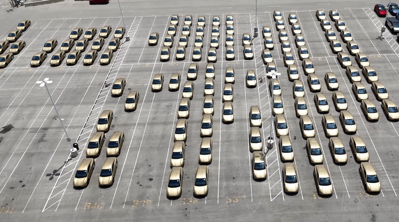Additional rows of gold Tesla Cybercabs staged in neat columns at Gigafactory Texas