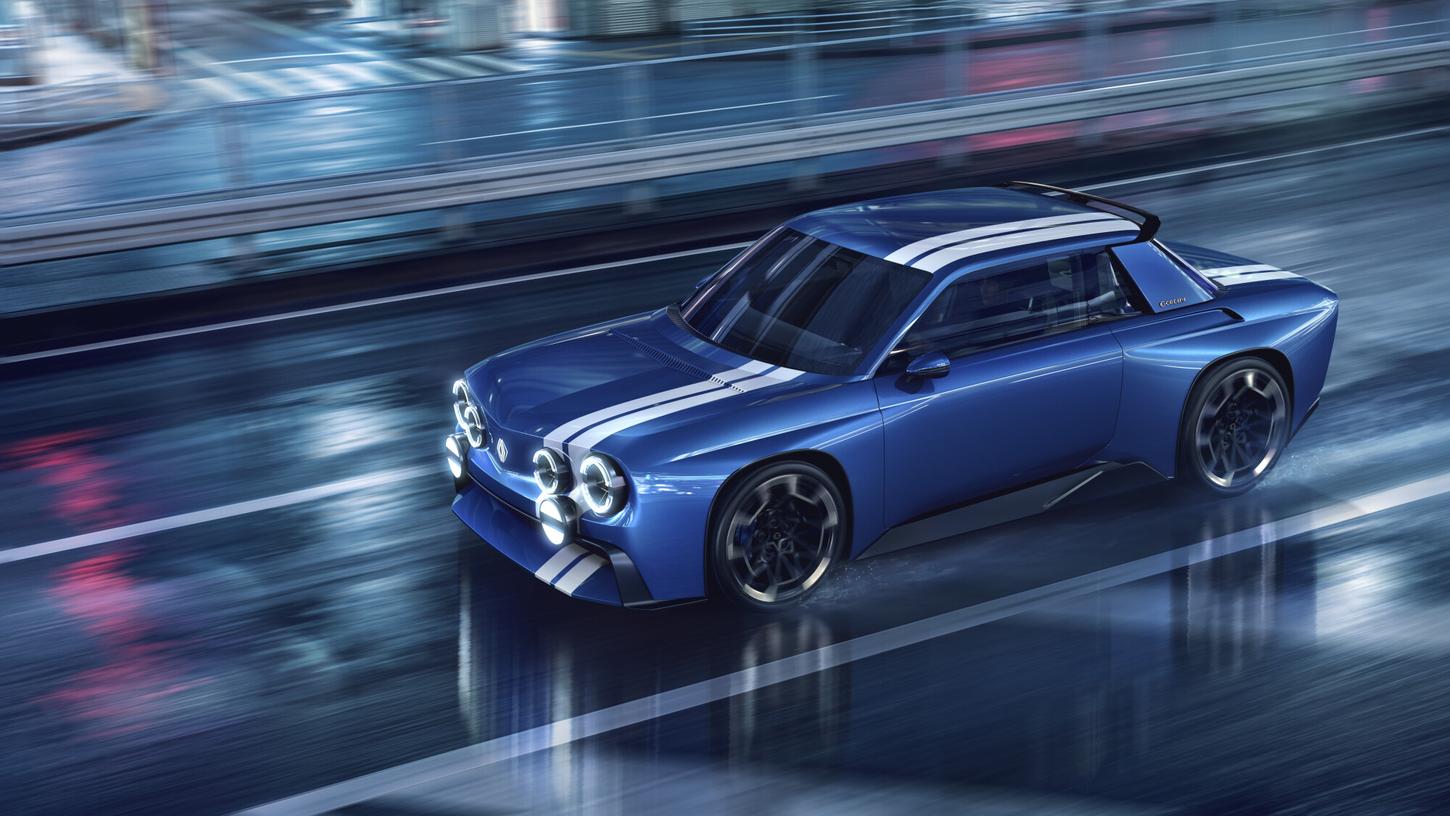 Blue Renault 8 Gordini Concept electric coupe with twin white stripes driving on a wet road