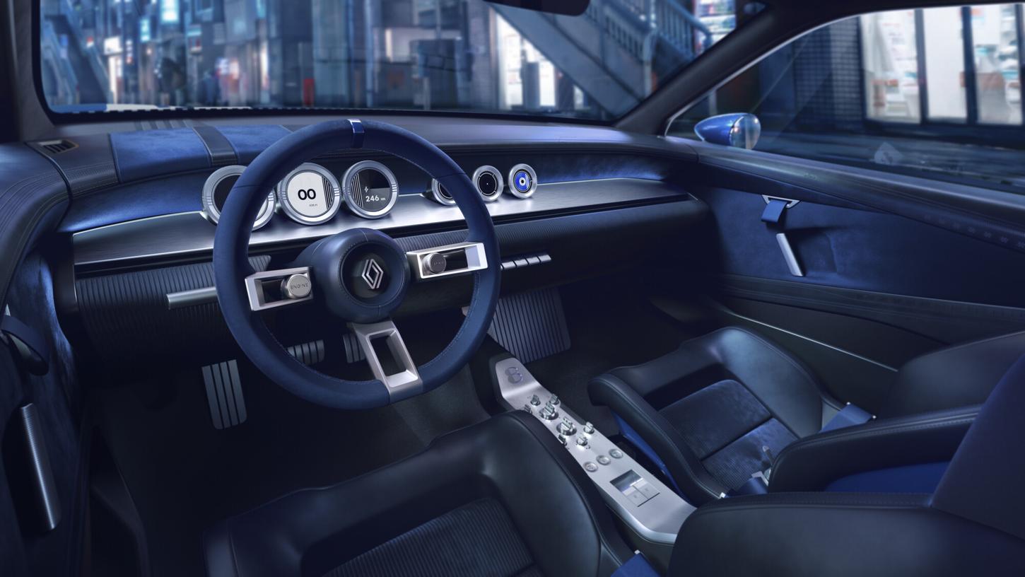 Interior of the Renault 8 Gordini Concept with a brushed aluminum dashboard, round digital dials and blue bucket seats