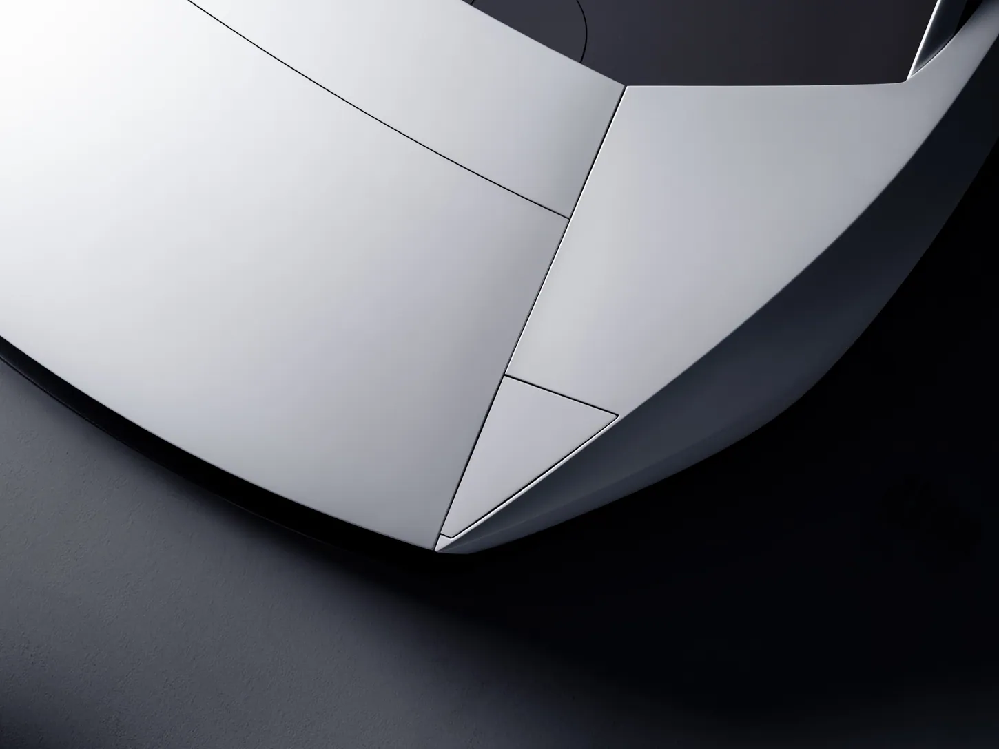 Close-up from above of the Tesla Roadster nose, showing the seams where the white hood and front wing panels meet