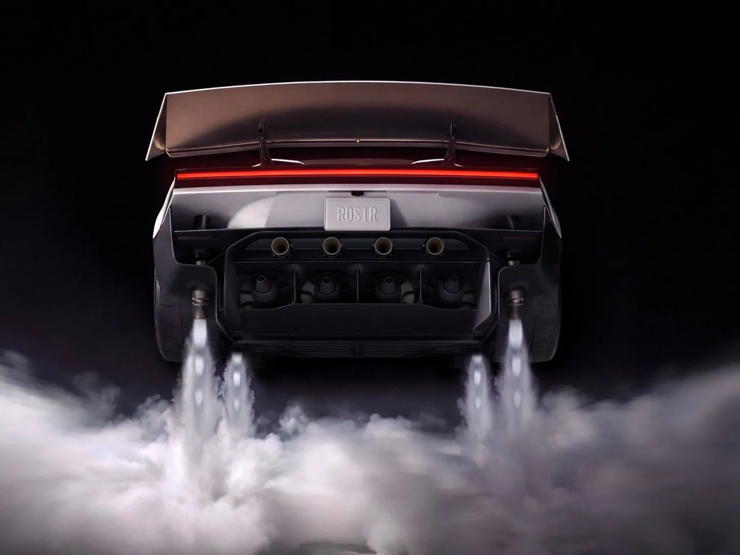Rear of the white Tesla Roadster showing four suction fans, four thruster nozzles and a RDSTR license plate under a large wing