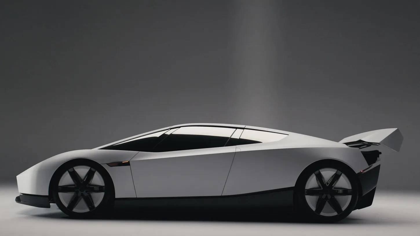 White Tesla Roadster in side profile in a gray studio, its rear wing raised high above the tail