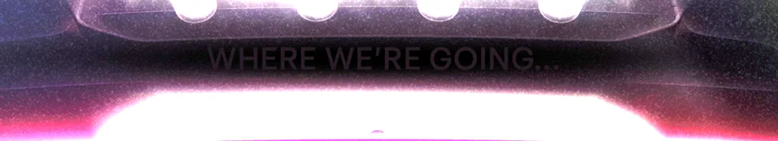 Brightened detail of the Tesla Roadster teaser showing the words Where we're going printed above the taillight