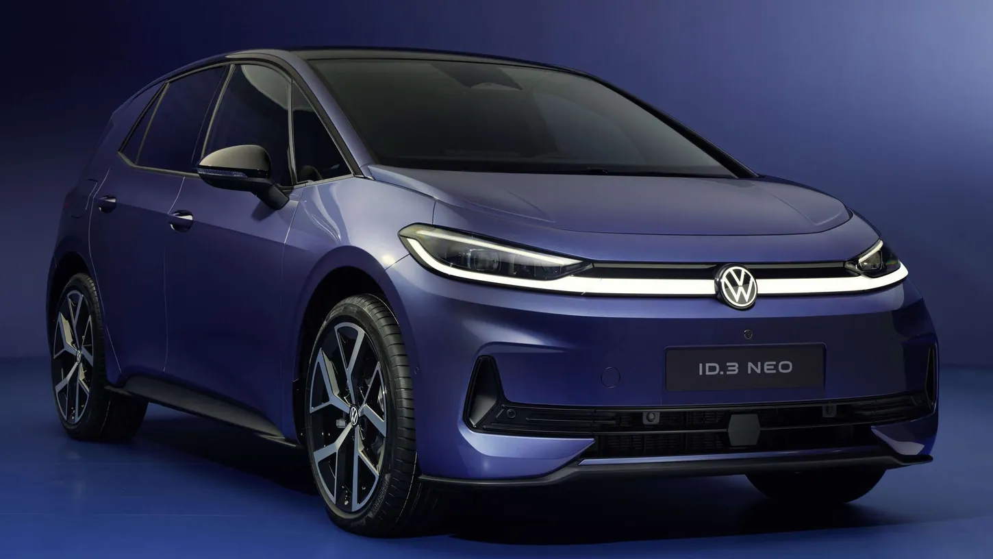 Blue Volkswagen ID.3 Neo electric hatchback seen from the front three-quarter in a dark blue studio